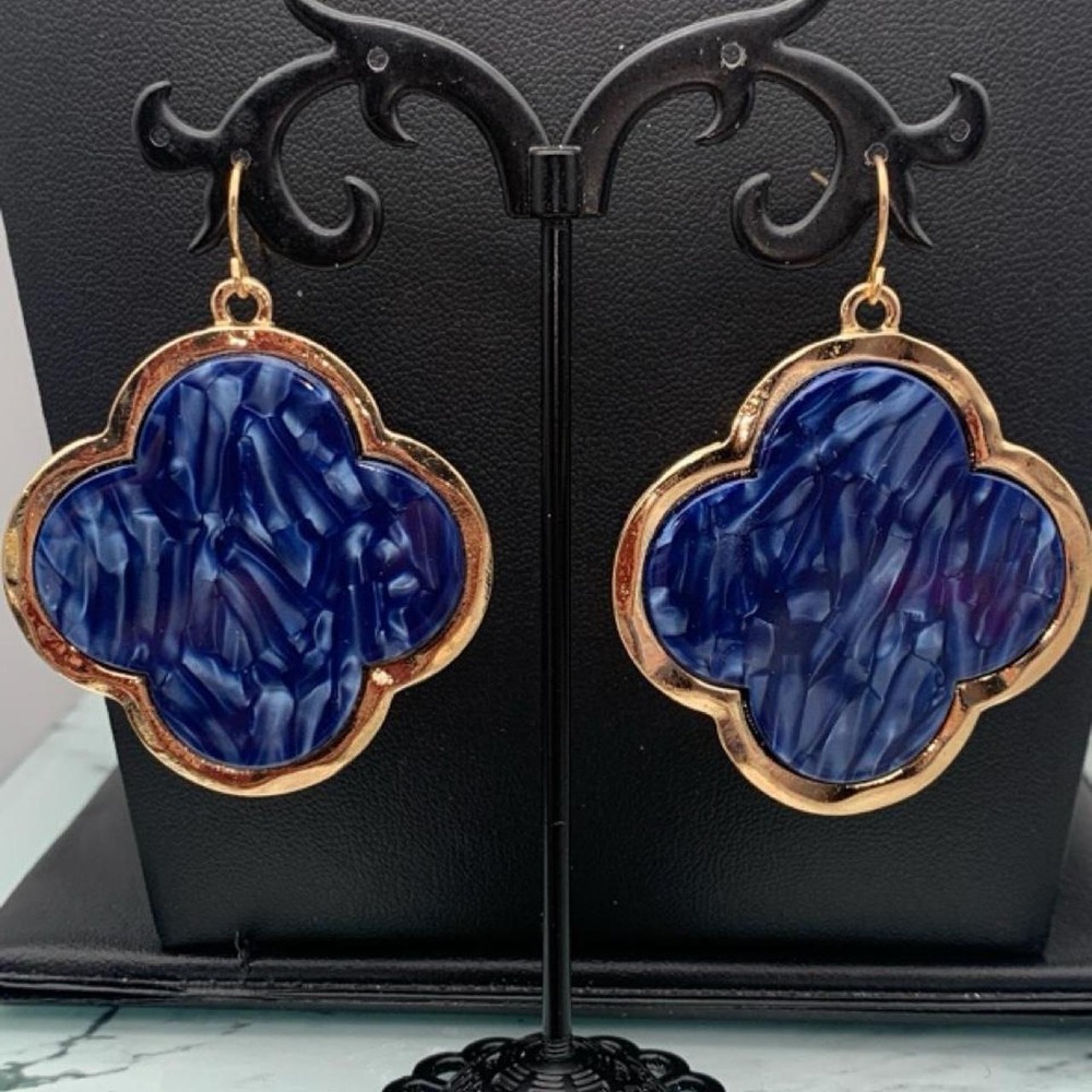 Blue and gold tone earrings with a clover shape